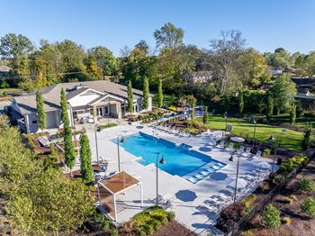 Resort-style pool with tanning ledges and cabanas